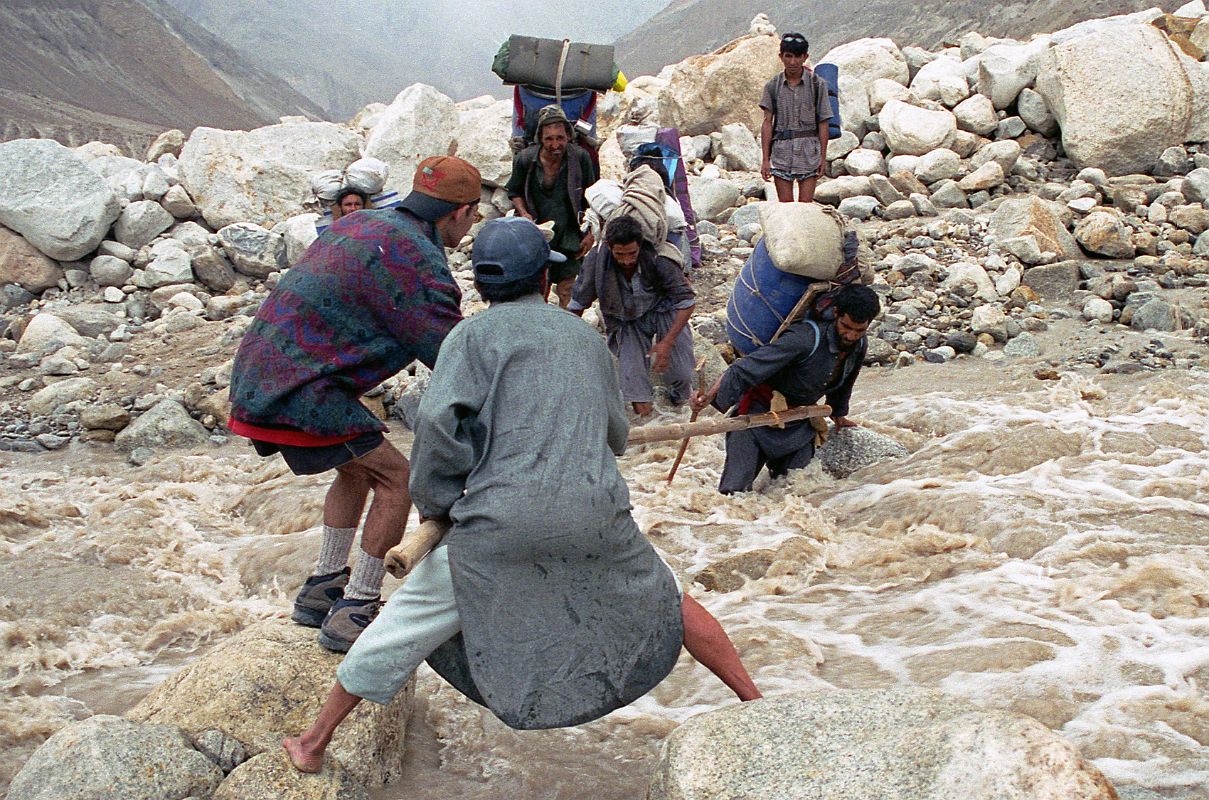 23 Ali And Naqi Help Porters Cross The Swollen River Descending From Paiju Glacier